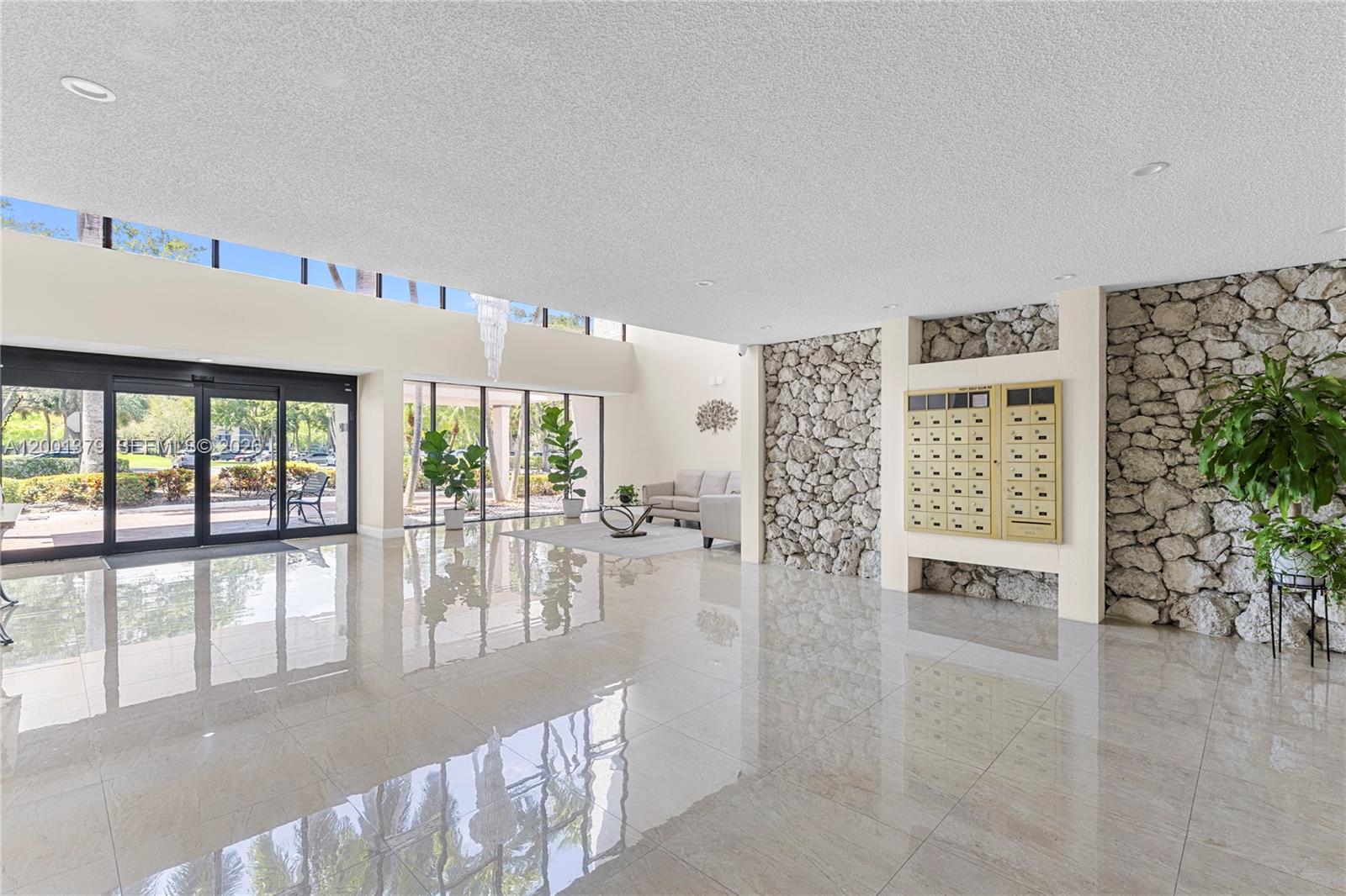 16251 Golf Club Road, Unit 311 Weston, FL 33326 - Photo 5 of 38 a view of a living room and window