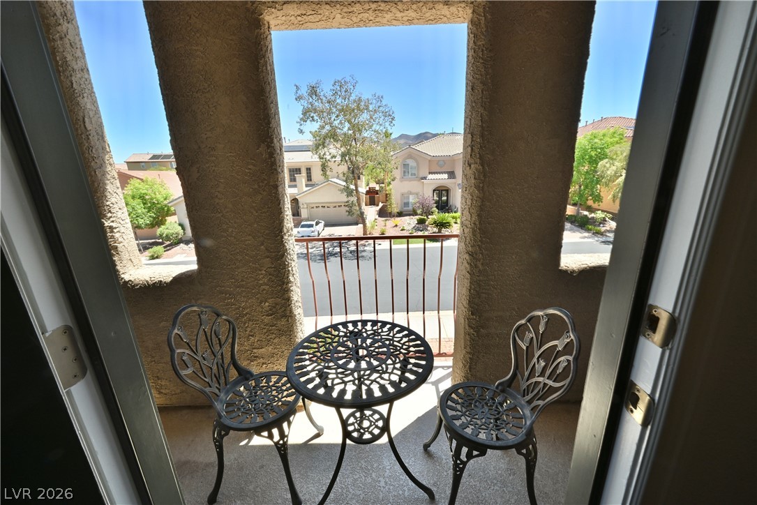 2729 Kildrummie Street Henderson, NV 89044 - Photo 25 of 42 A cozy outdoor seating area offers refreshing views of the neighborhood.