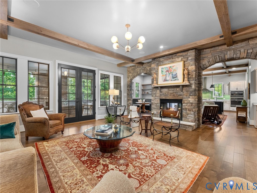 16131 Binley Road Midlothian, VA 23112 - Photo 22 of 99 a living room with furniture a fireplace and a table