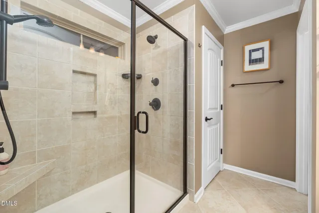 a spacious bedroom with a bed and a cabinets