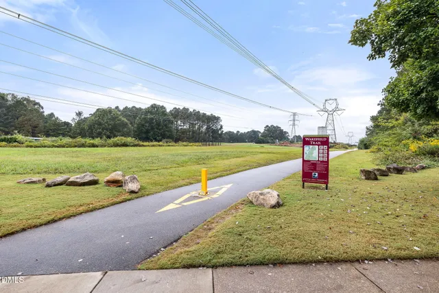 an aerial view of a house with yard swimming pool and outdoor seating