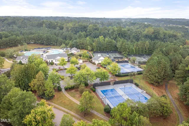 an aerial view of residential house with outdoor space and lake view
