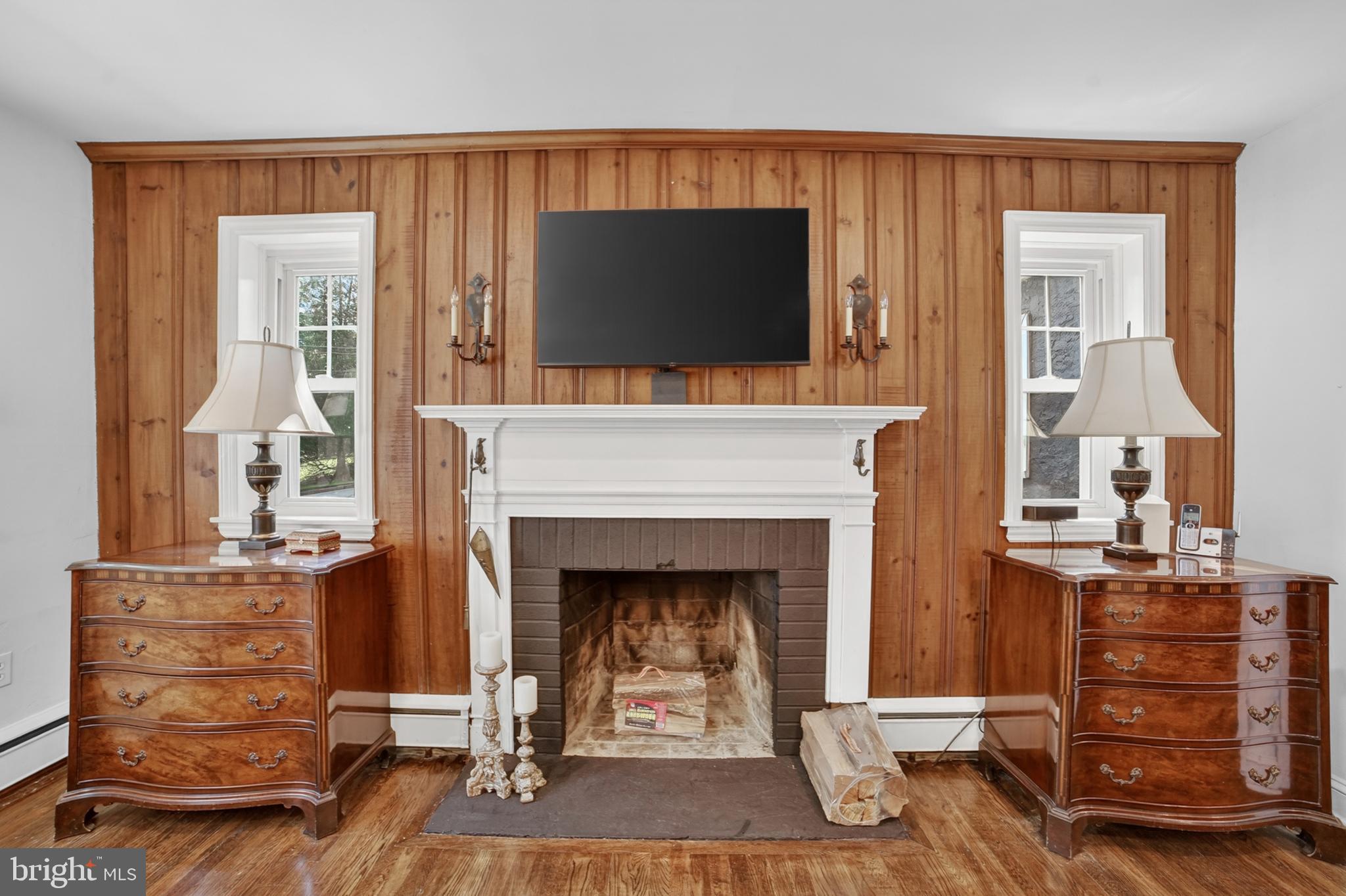 305 Irish Road Berwyn, PA 19312 - Photo 7 of 34 a living room with furniture and a fireplace