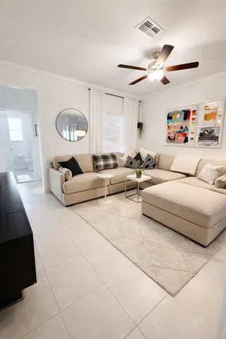 a living room with furniture and a window