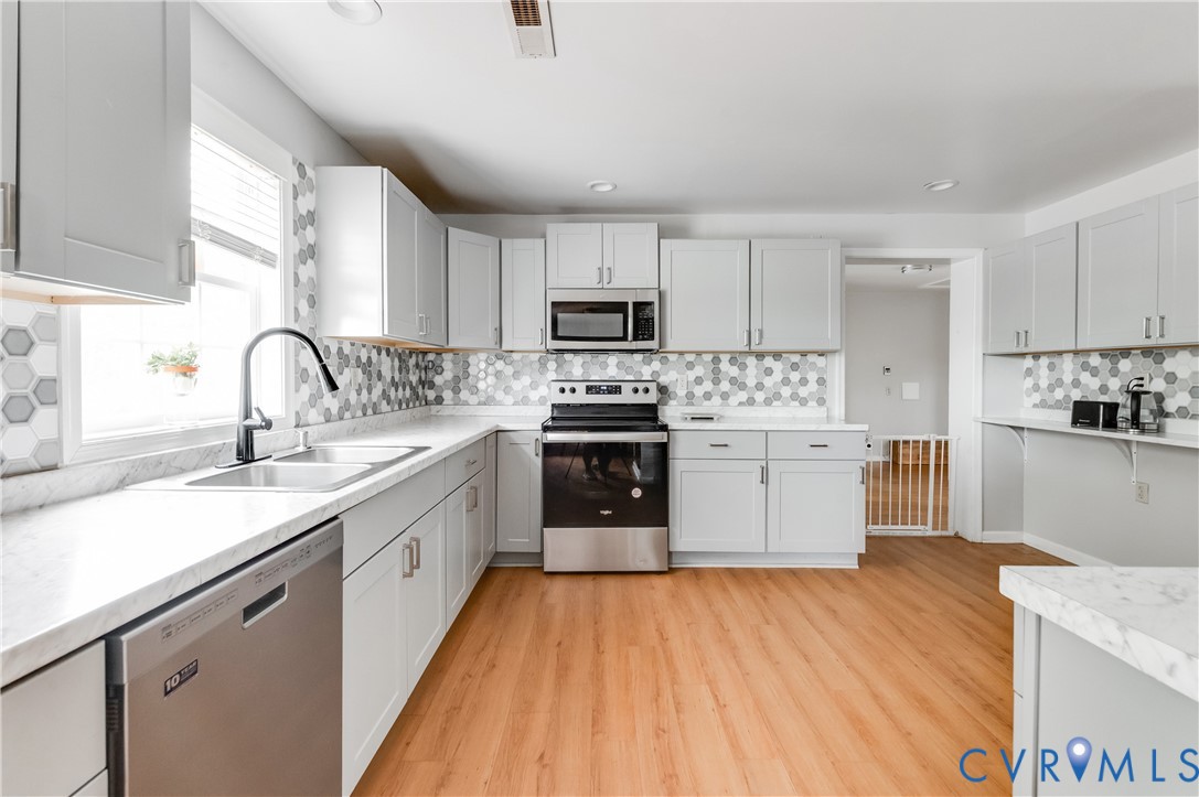 1474 Welsh Tract Road Charlotte Court House, VA 23923 - Photo 9 of 48 Renovated kitchen featuring light gray cabinetry,