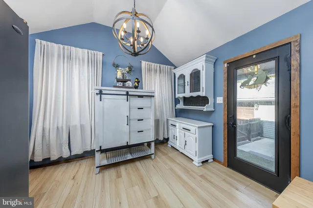a view of a kitchen with dishwasher and wooden floor