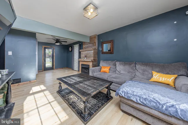 a living room with a couch and a rug