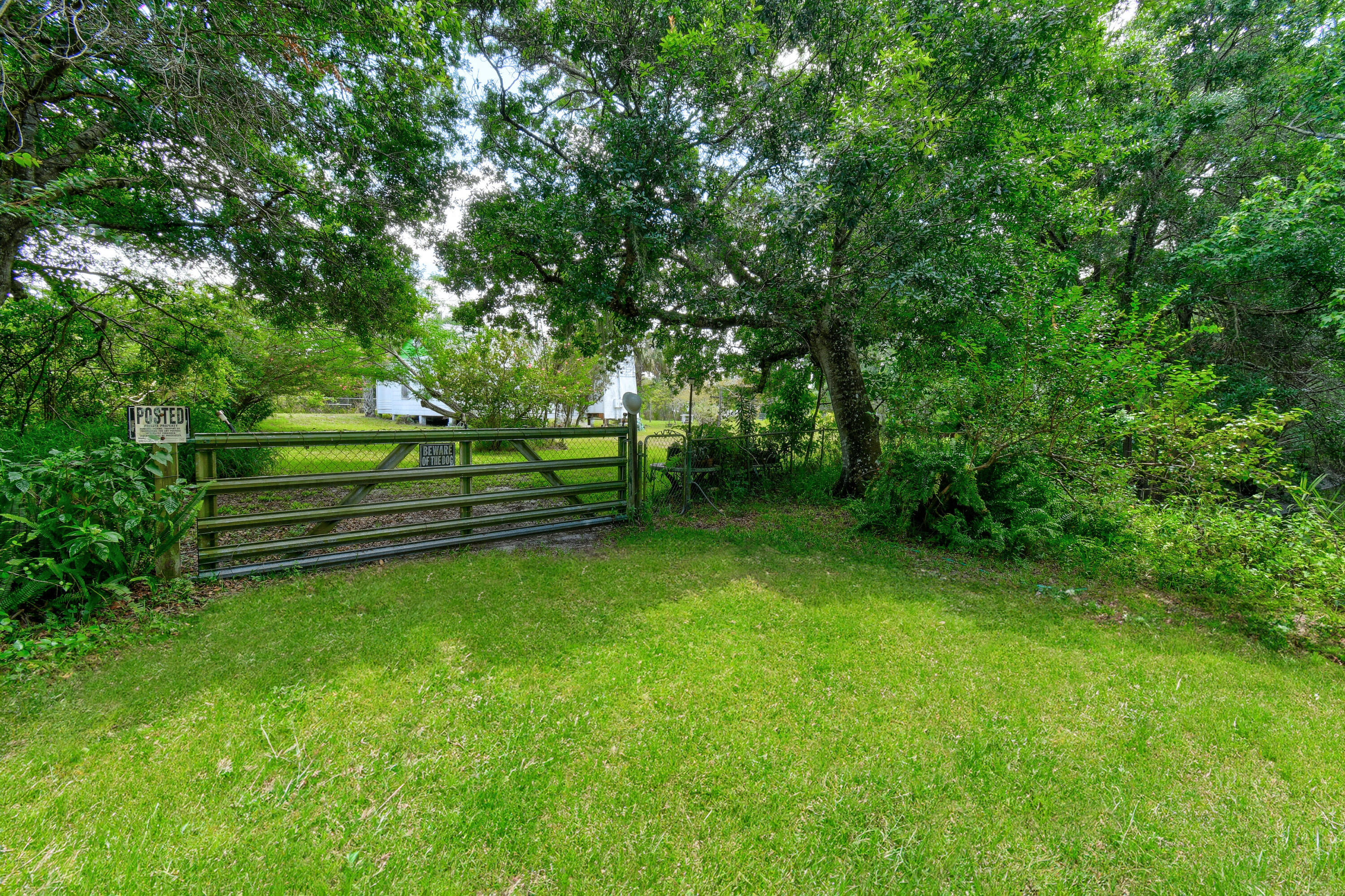 332 Southwest Salerno Road Stuart, FL 34997 - Photo 11 of 17 a view of a park with large trees