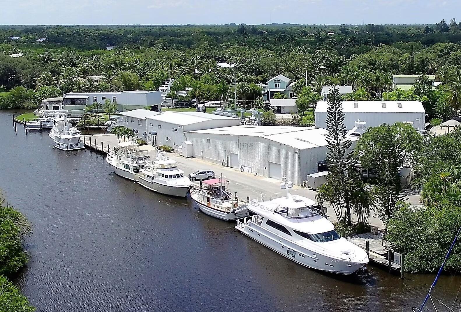332 Southwest Salerno Road Stuart, FL 34997 - Photo 13 of 17 a view of a lake with a car parked on the road