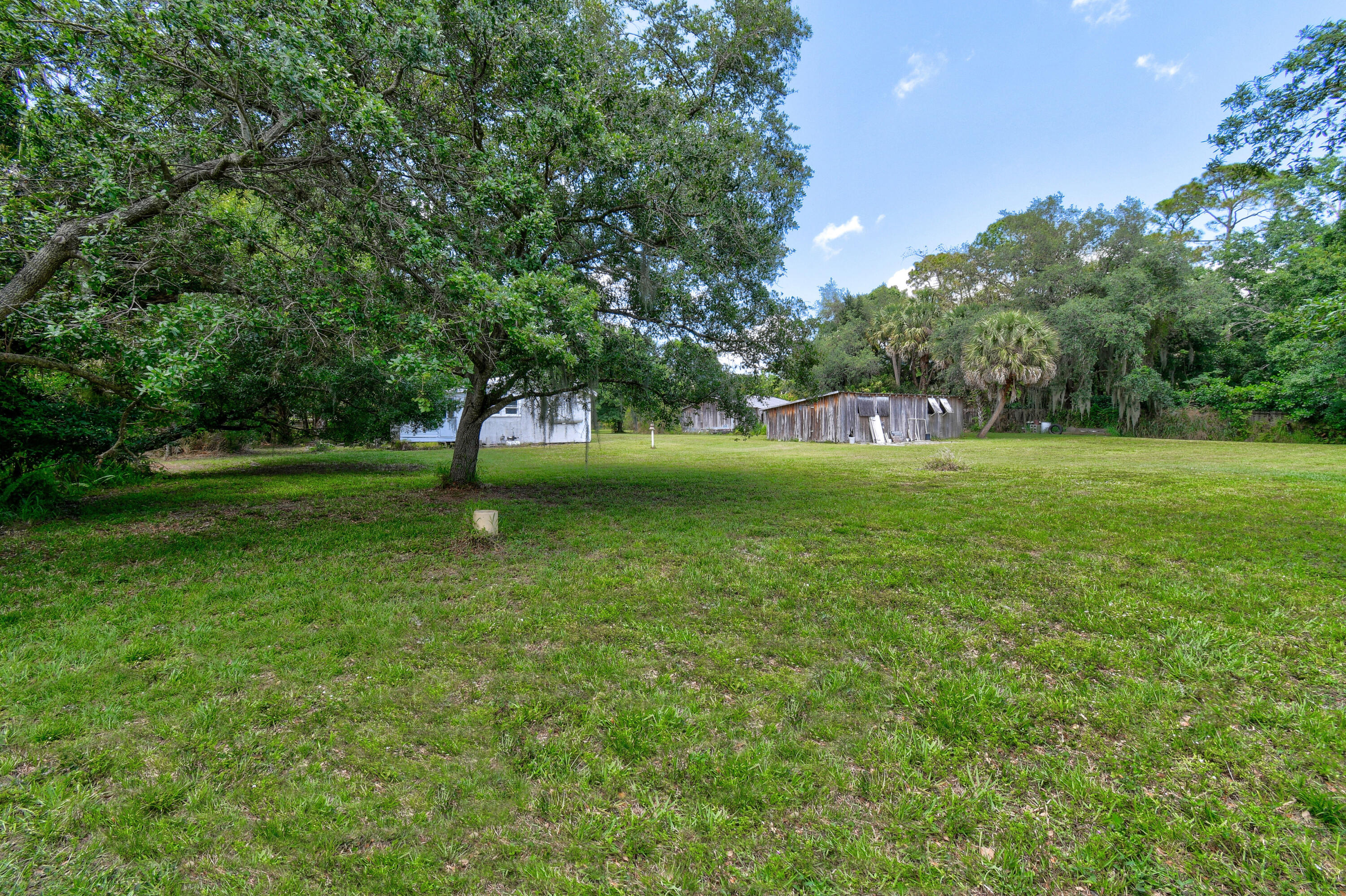 332 Southwest Salerno Road Stuart, FL 34997 - Photo 10 of 17 a view of grassy field with trees