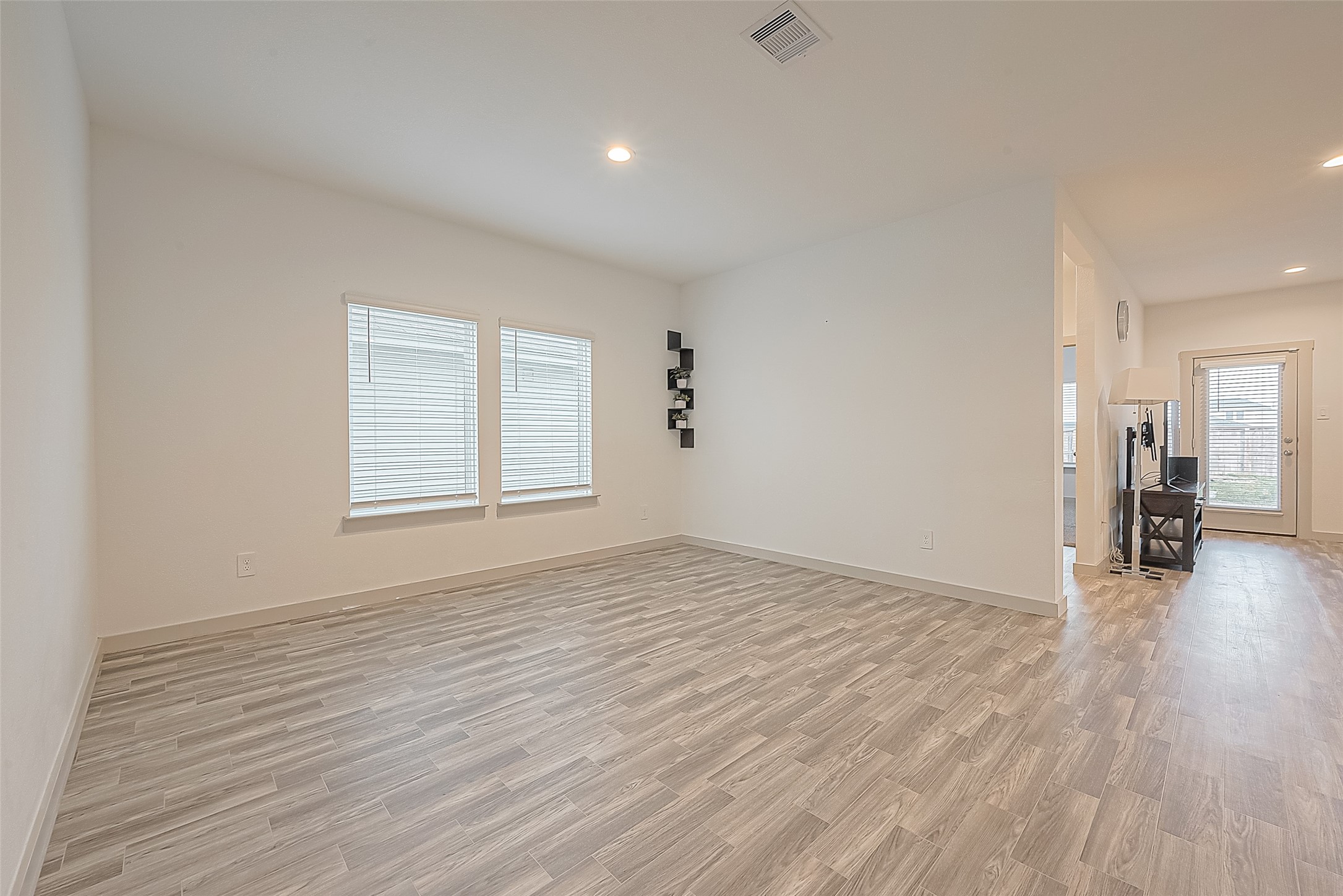1815 Sandy Trail Lane Rosenberg, TX 77469 - Photo 10 of 47 a view of empty room with wooden floor and fan