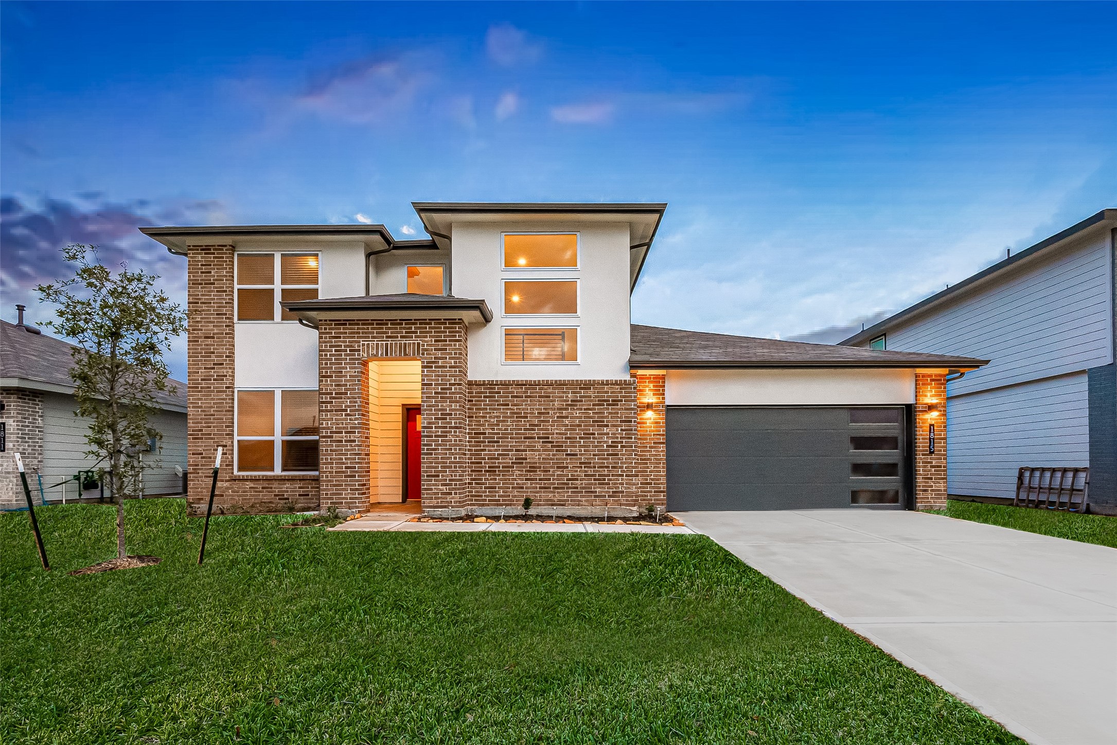 a front view of a house with a yard