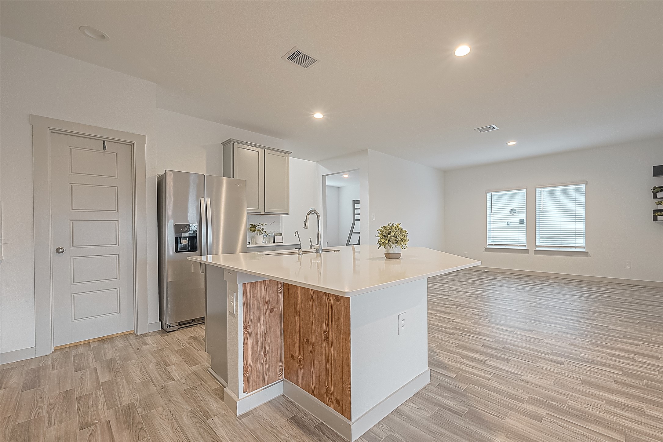 1815 Sandy Trail Lane Rosenberg, TX 77469 - Photo 21 of 47 a view of kitchen with refrigerator cabinets and wooden floor