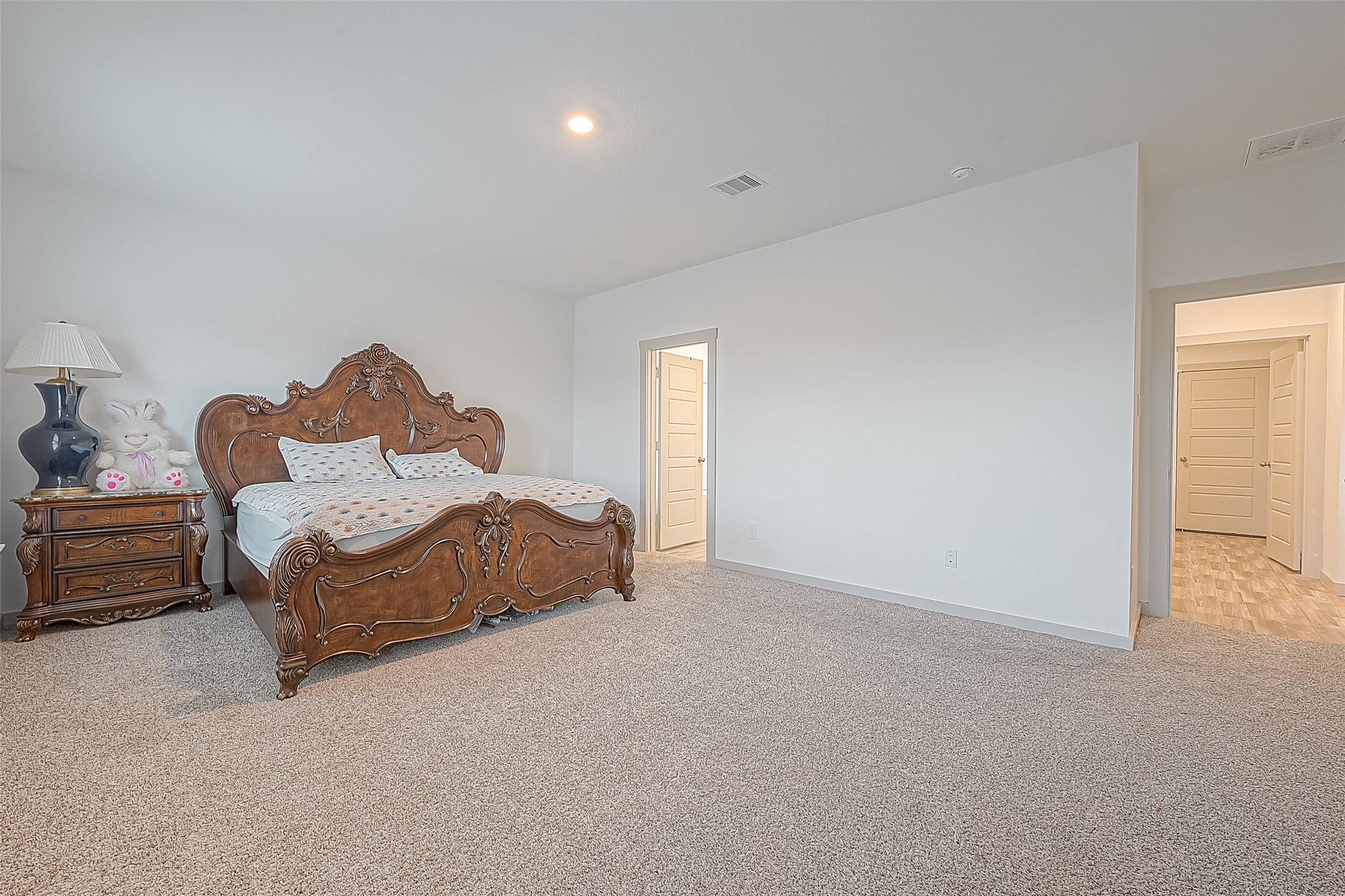 1815 Sandy Trail Lane Rosenberg, TX 77469 - Photo 22 of 47 a spacious bedroom with a bed and a window
