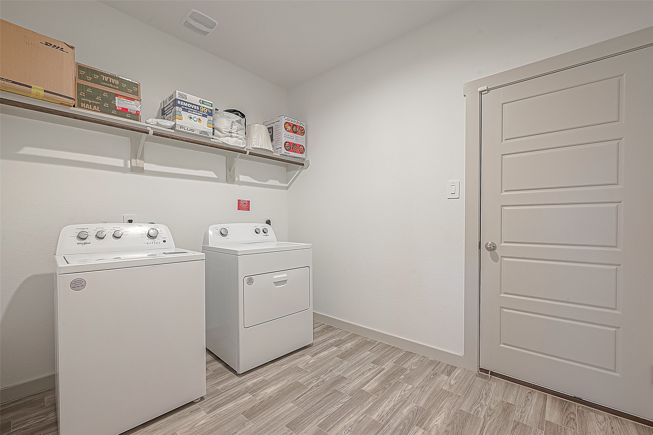 1815 Sandy Trail Lane Rosenberg, TX 77469 - Photo 30 of 47 a view of storage and utility room with washer and dryer