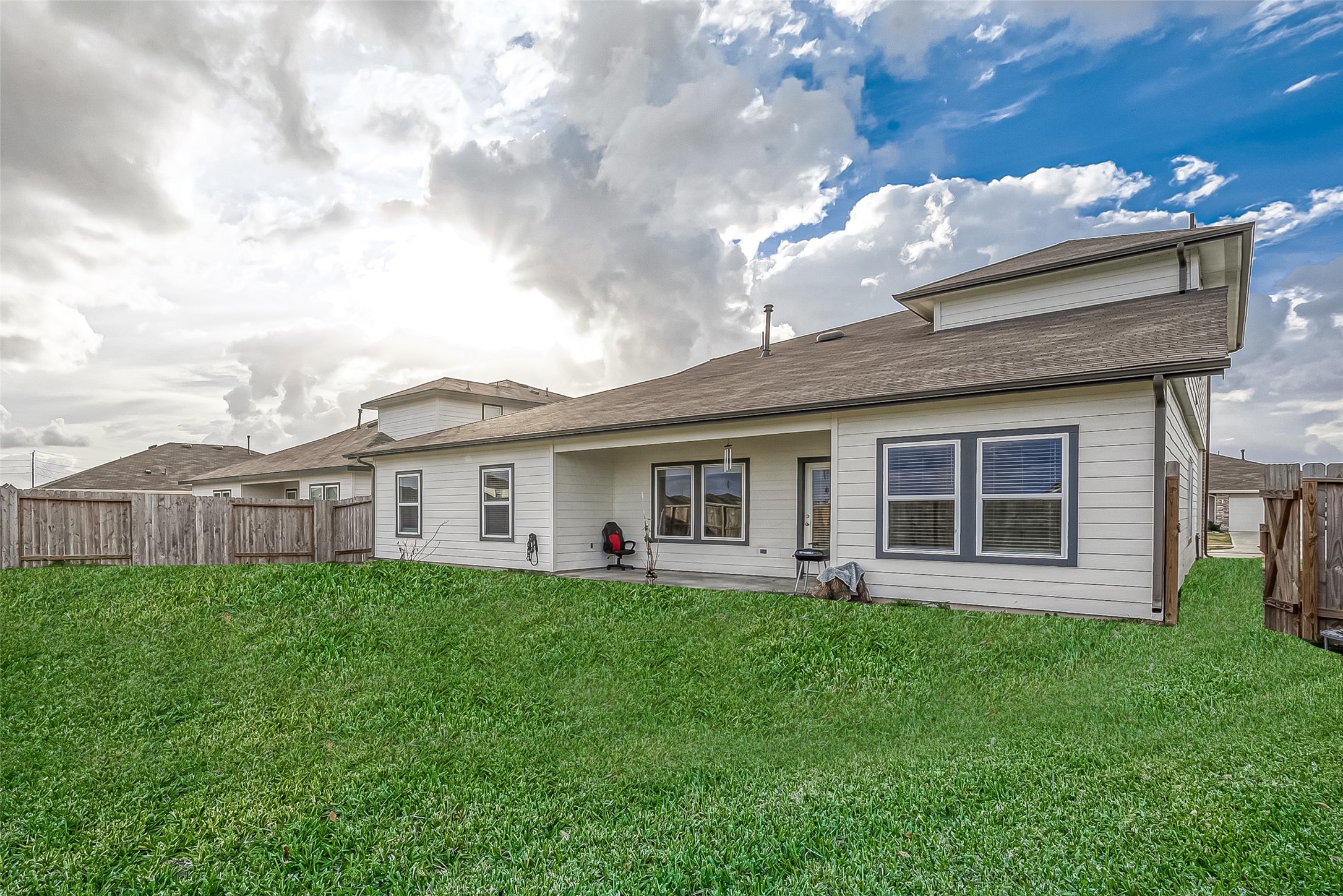 1815 Sandy Trail Lane Rosenberg, TX 77469 - Photo 43 of 47 a view of a house with a yard and a large tree