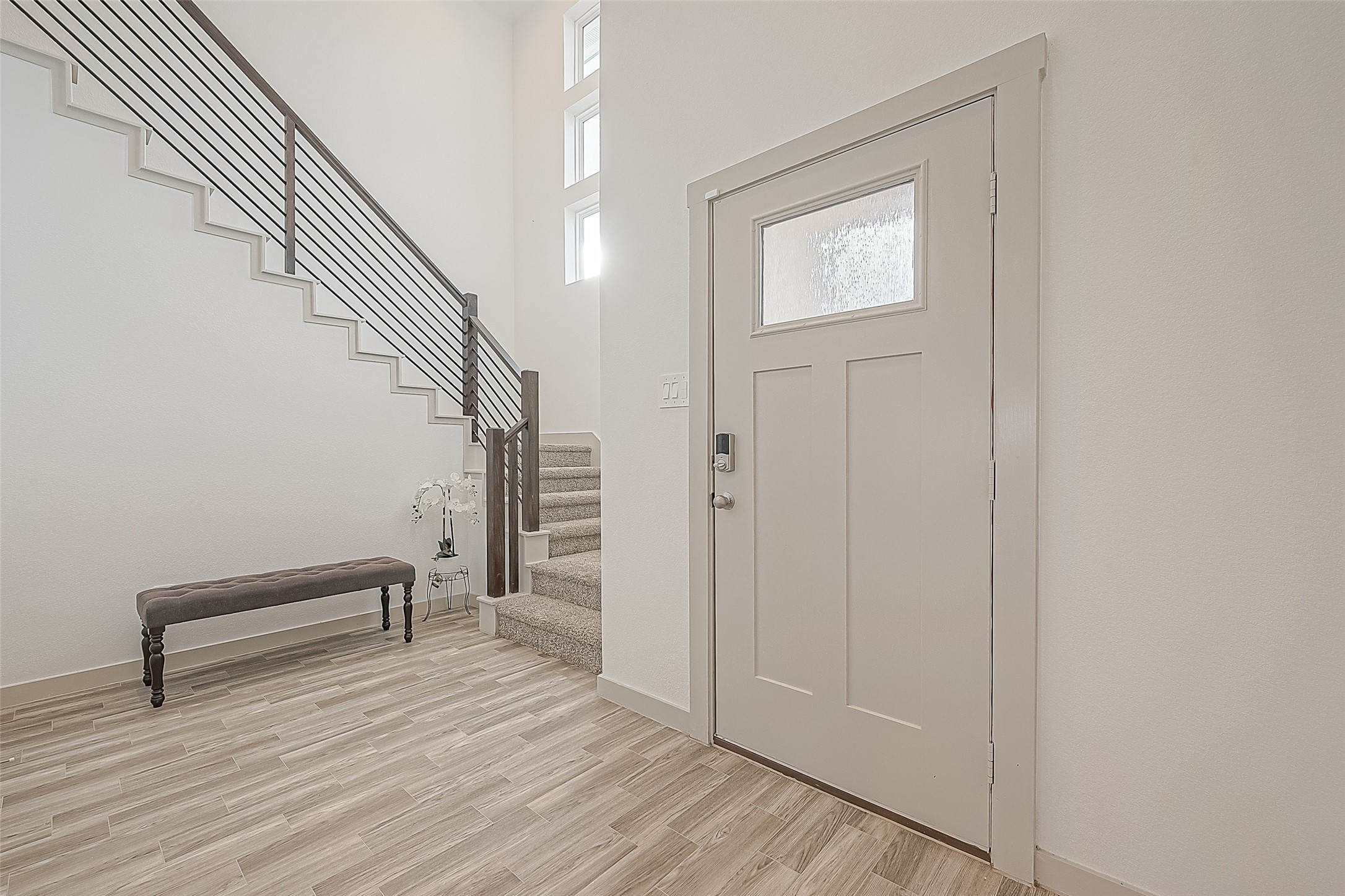 1815 Sandy Trail Lane Rosenberg, TX 77469 - Photo 7 of 47 a view of entryway and hall with wooden floor