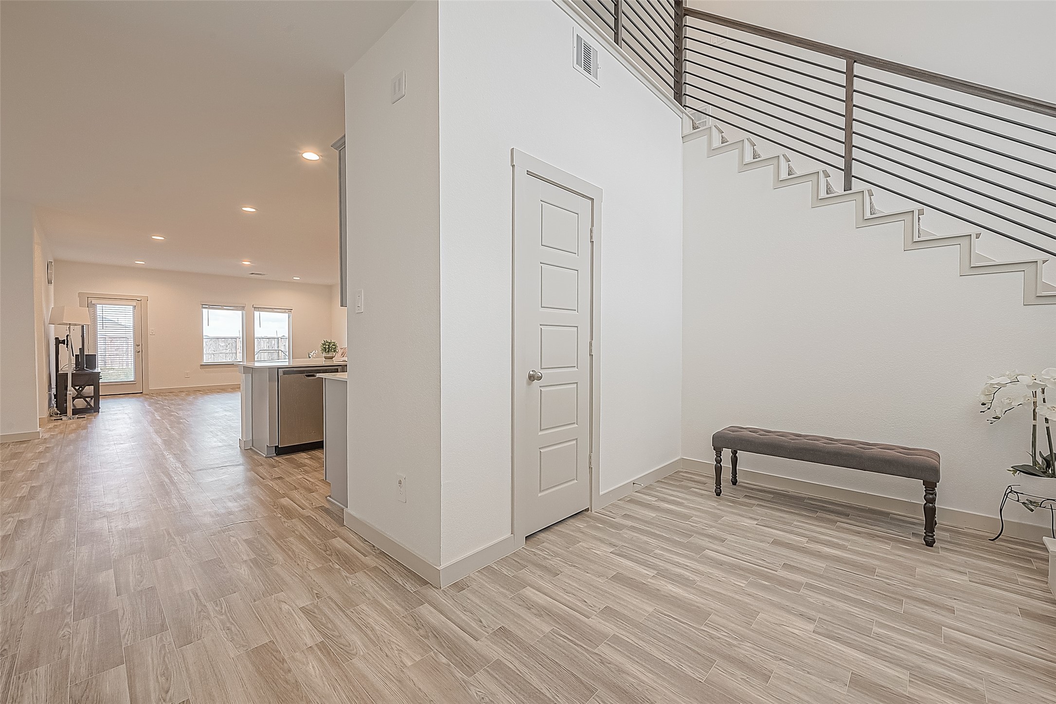 1815 Sandy Trail Lane Rosenberg, TX 77469 - Photo 8 of 47 a view of a hallway with wooden floor and furniture