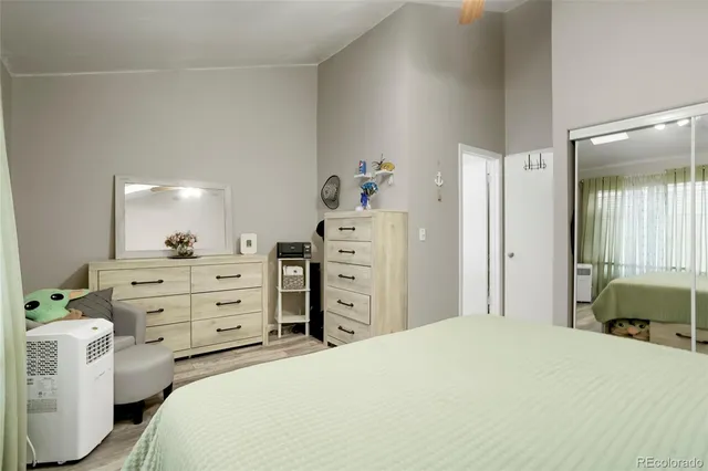 a bedroom with a bed and a dresser