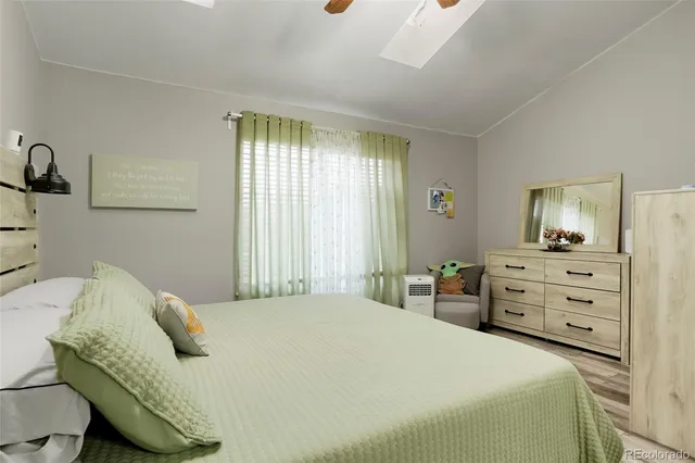 a bedroom with a bed and dresser