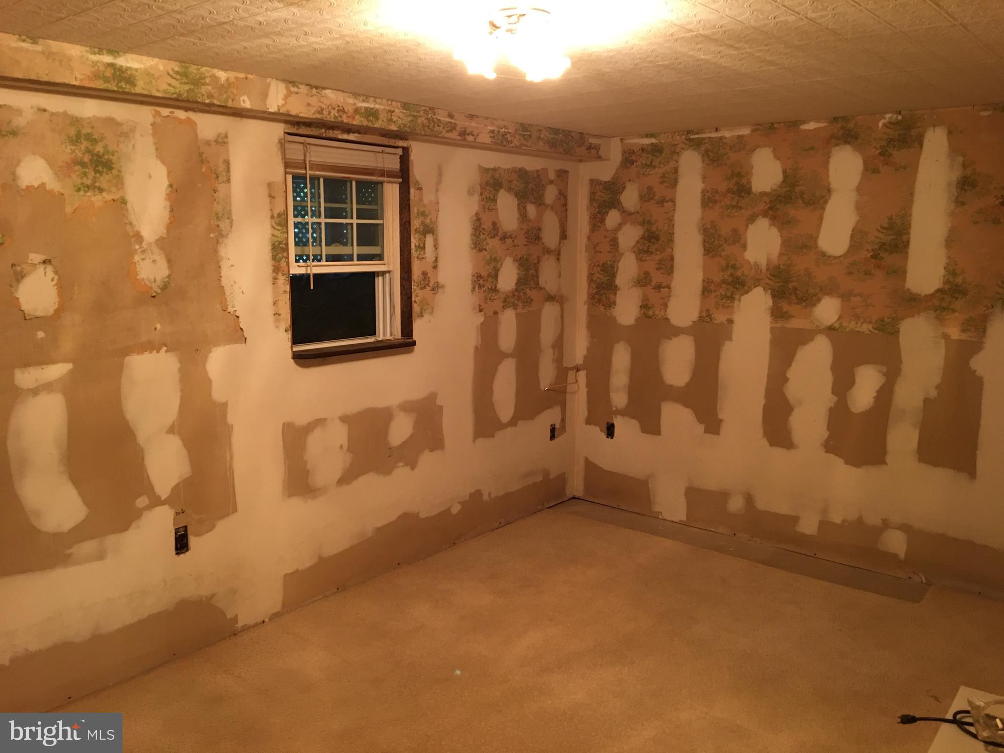 3551 Goldmine Road Goldvein, VA 22720 - Photo 23 of 27 Seller in the process of removing wall paper