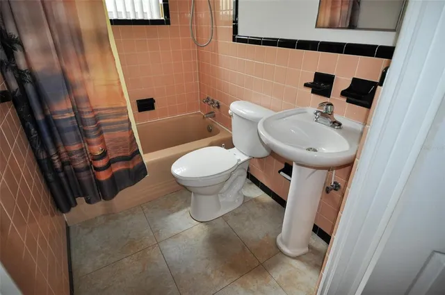 a bathroom with a sink and toilet