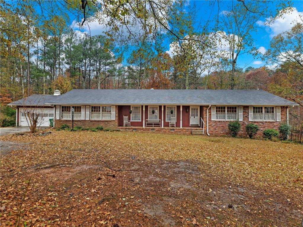2731 River Road Ellenwood, GA 30294 - Photo 1 of 1 a front view of a house with a garden