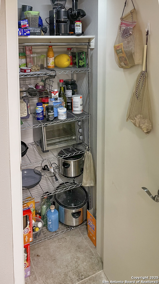 7701 Wurzbach Road, Unit 703 San Antonio, TX 78229 - Photo 11 of 28 a room with storage and utility