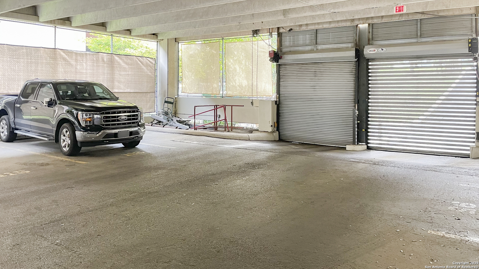 7701 Wurzbach Road, Unit 703 San Antonio, TX 78229 - Photo 19 of 28 a car parked in front of house