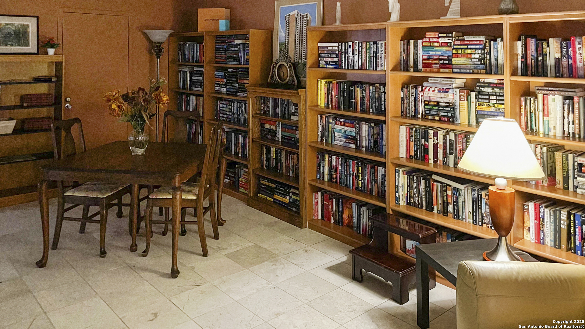 7701 Wurzbach Road, Unit 703 San Antonio, TX 78229 - Photo 20 of 28 a view of a workspace room with furniture and book shelf