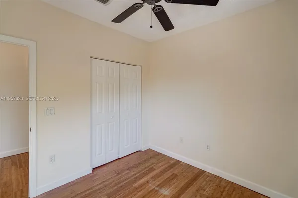 a view of a room with wooden floor