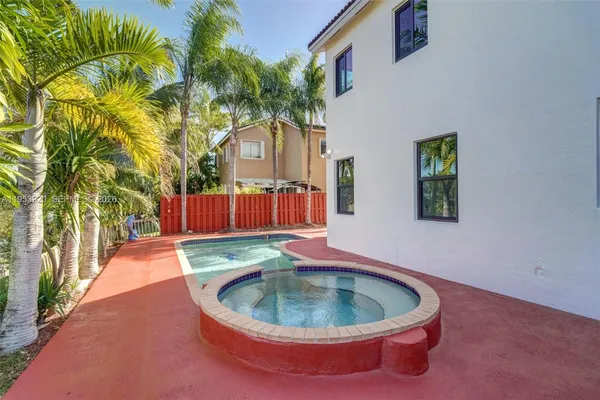 a view of swimming pool from a lake view