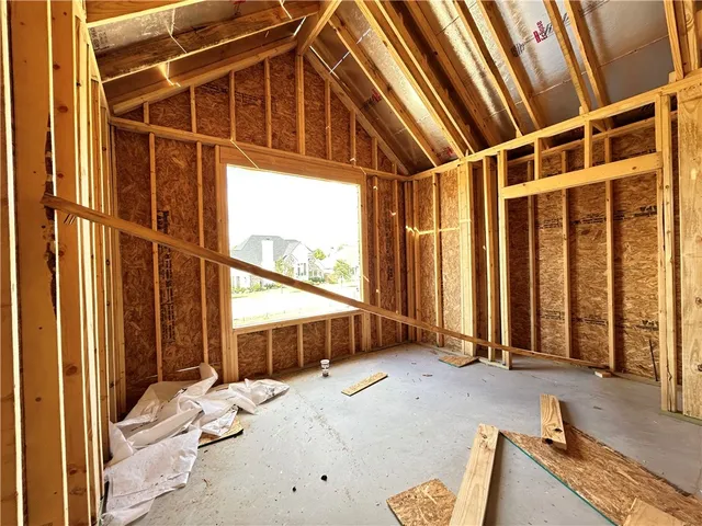 a bed room with a bed and a window