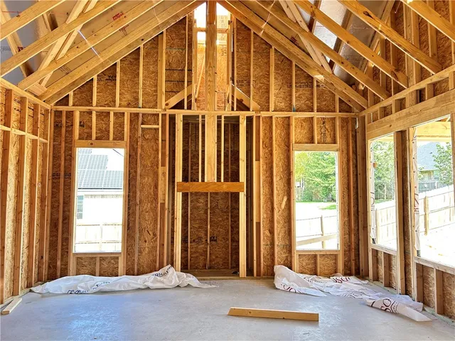 a view of a room with large windows