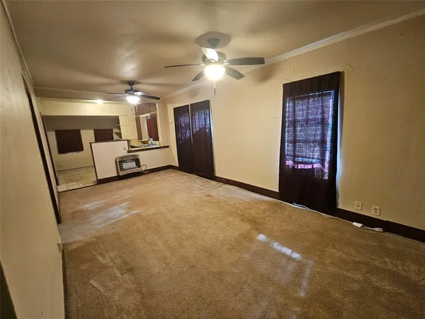 a view of an empty room with a fireplace