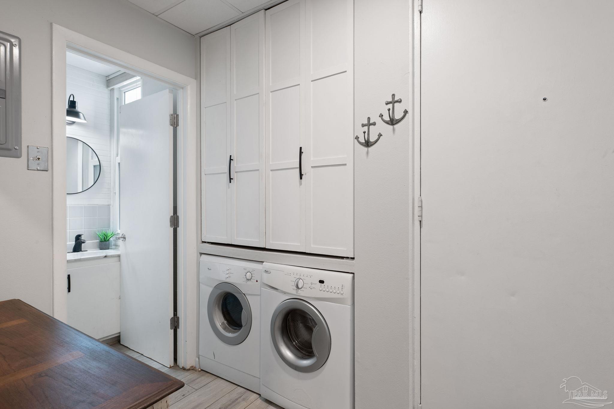 201 Pensacola Beach Road, Unit D24 Gulf Breeze, FL 32561 - Photo 11 of 29 a utility room with dryer and washer