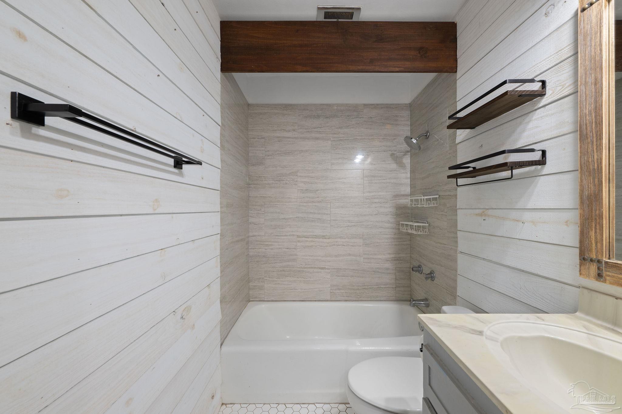 201 Pensacola Beach Road, Unit D24 Gulf Breeze, FL 32561 - Photo 17 of 29 a bathroom with a sink a toilet and bathtub