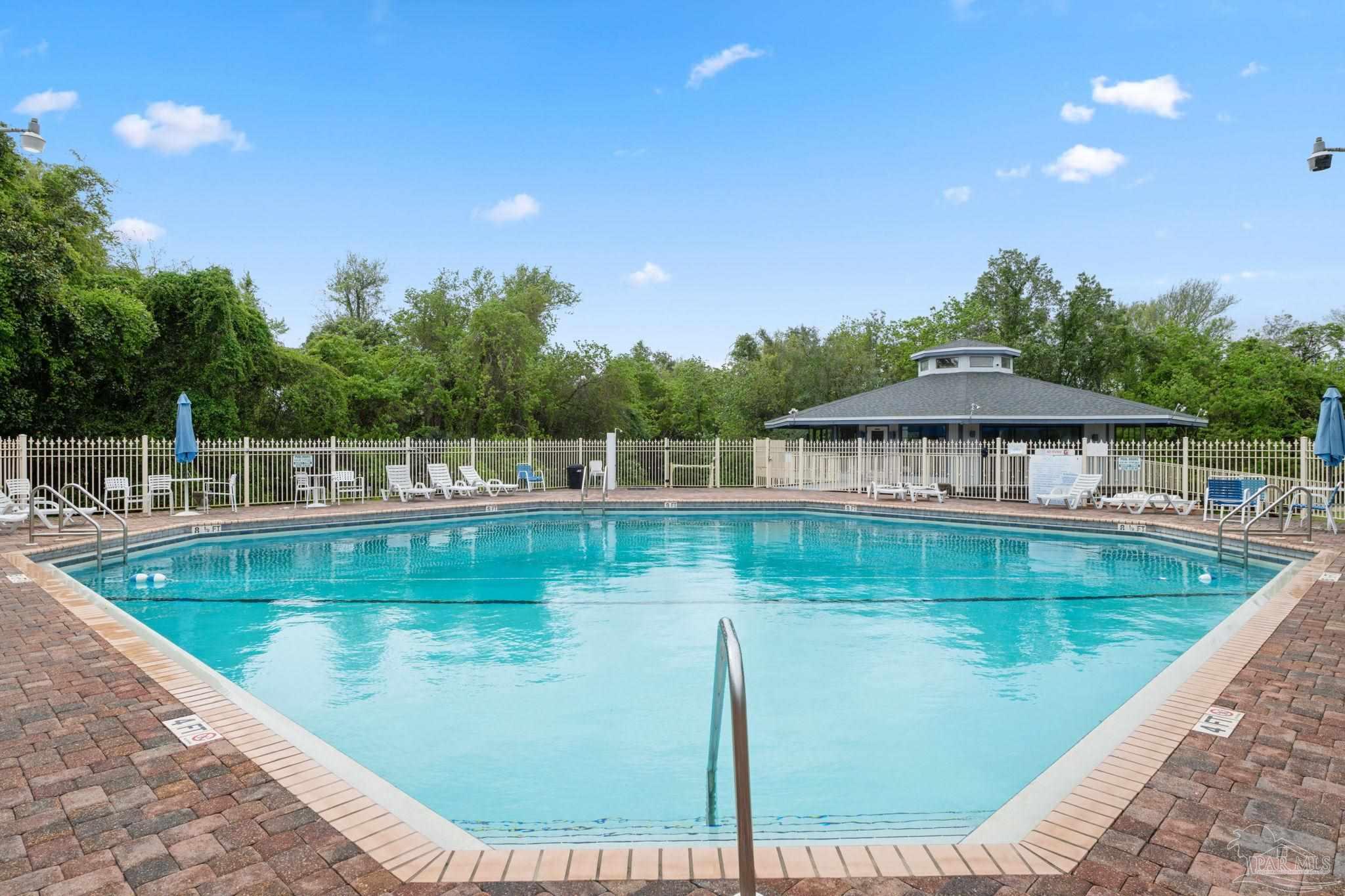 201 Pensacola Beach Road, Unit D24 Gulf Breeze, FL 32561 - Photo 2 of 29 a view of a swimming pool with a patio