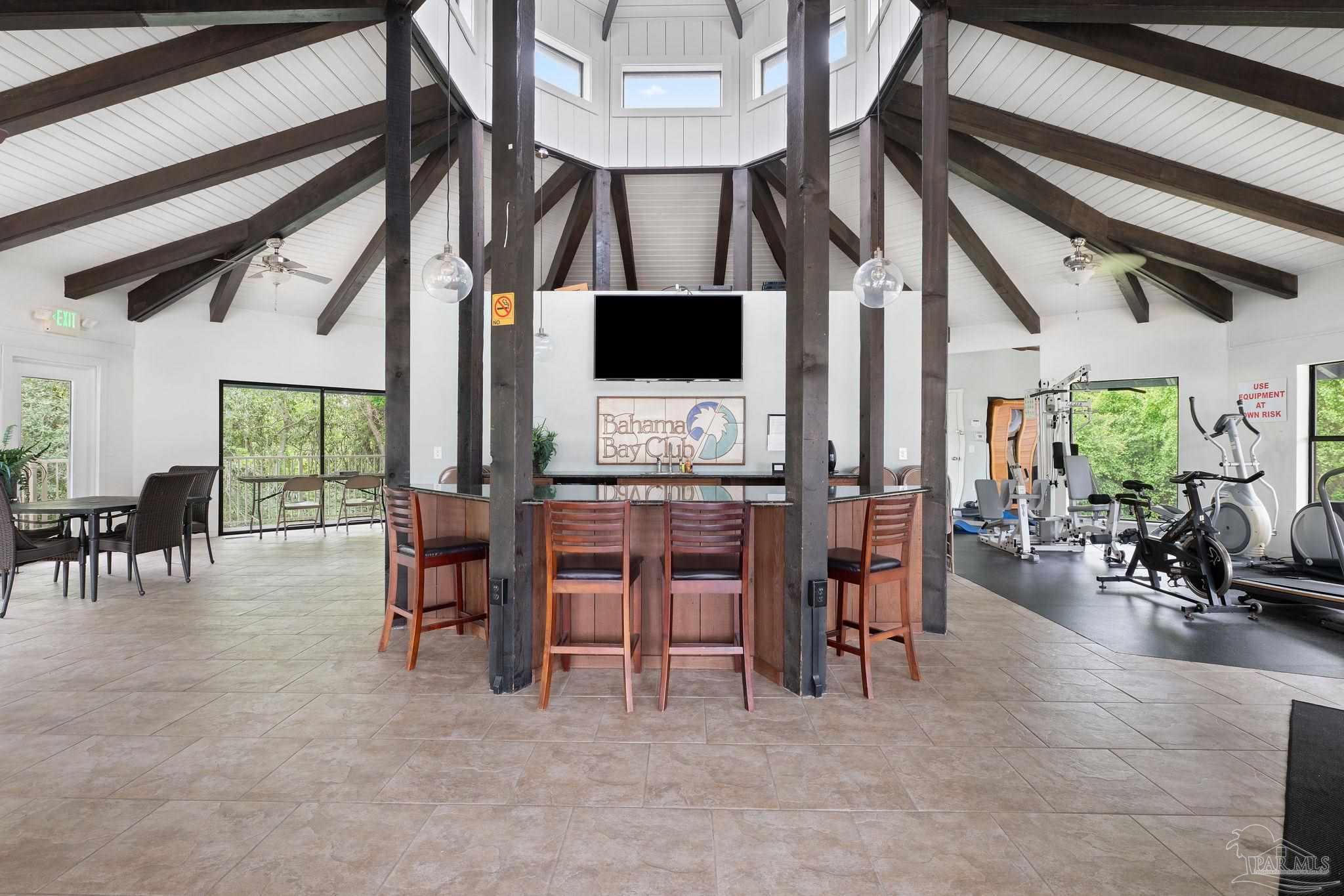 201 Pensacola Beach Road, Unit D24 Gulf Breeze, FL 32561 - Photo 29 of 29 a living room with furniture and a flat screen tv