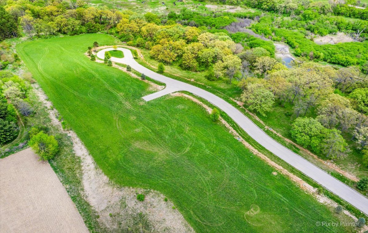 4002 Riverside Drive Johnsburg, IL 60051 - Photo 24 of 29 a view of a lake with huge green field and large trees
