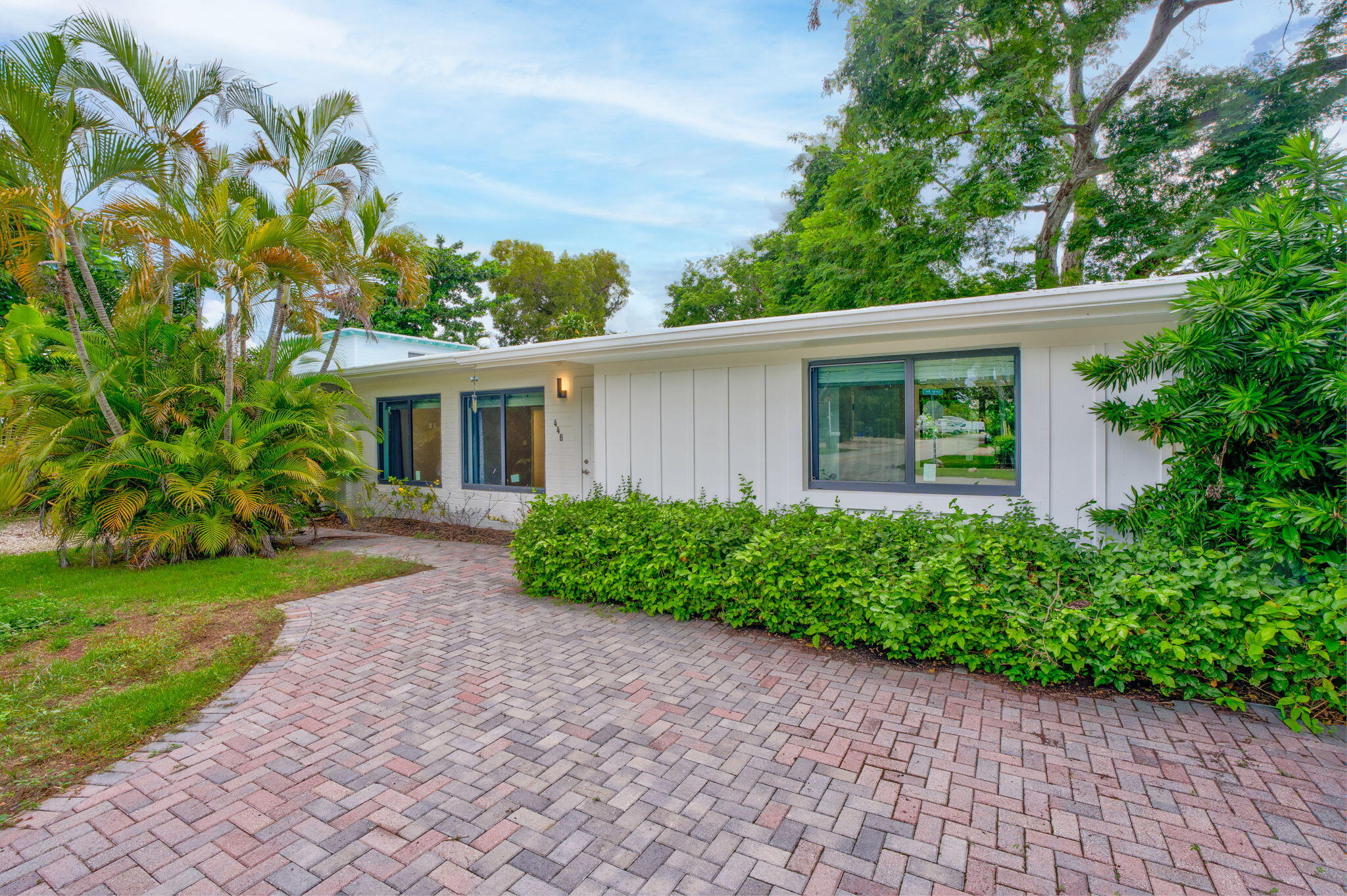 446 Largo Avenue Key Largo, FL 33037 - Photo 18 of 18 a front view of a house with a garden