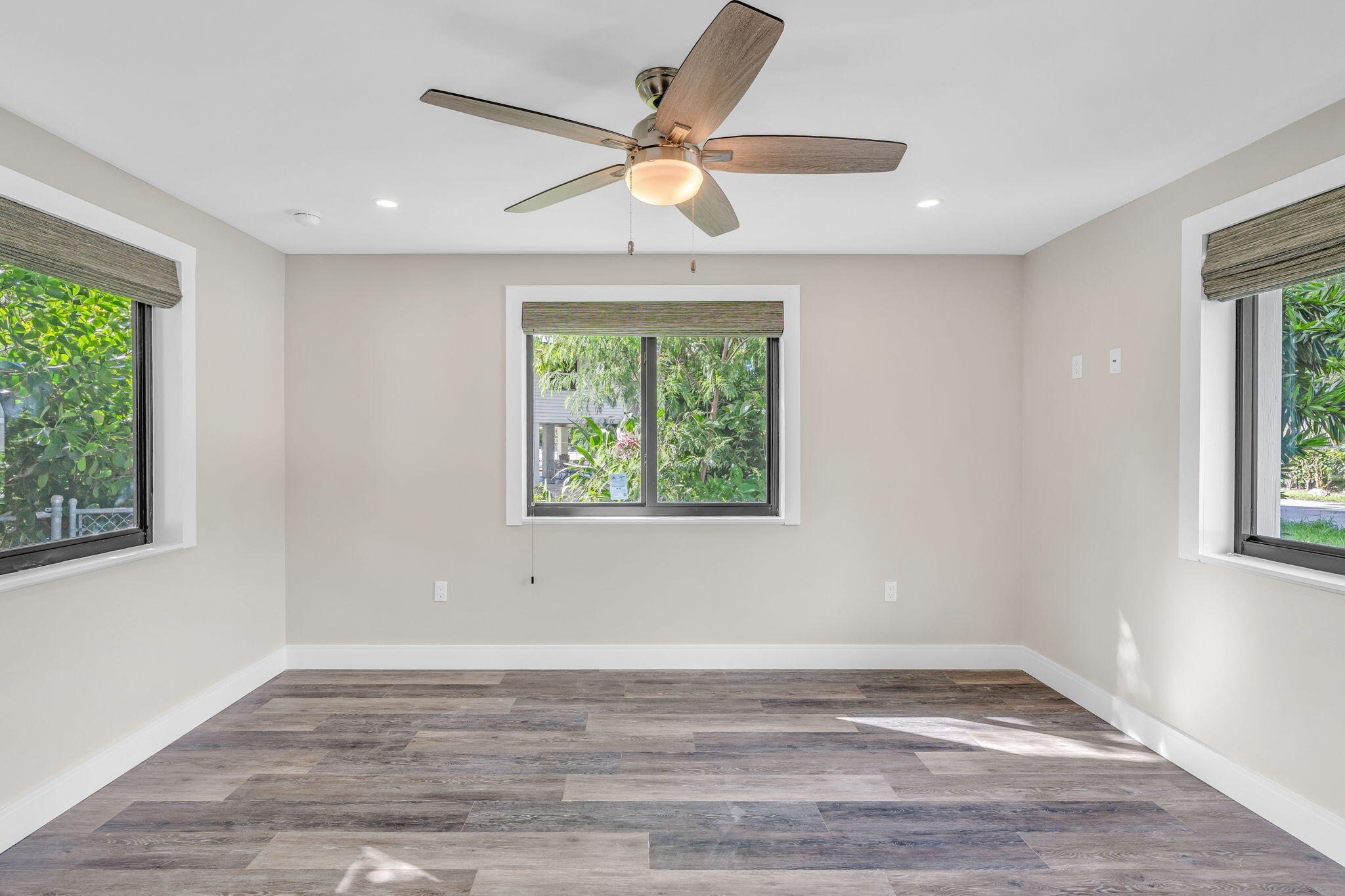 446 Largo Avenue Key Largo, FL 33037 - Photo 4 of 18 a view of an empty room with wooden floor and a window