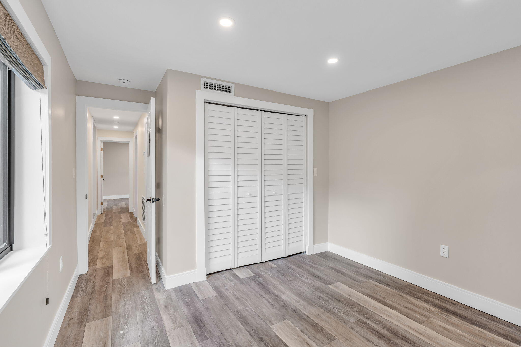 446 Largo Avenue Key Largo, FL 33037 - Photo 6 of 18 wooden floor in an empty room with a window