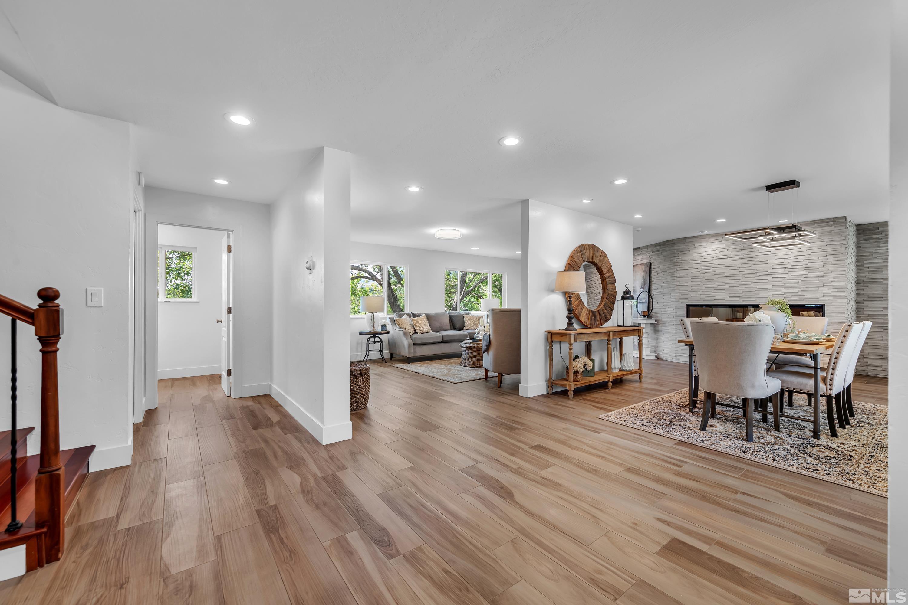 2370 Fireside Circle Reno, NV 89509 - Photo 16 of 29 a living room with furniture a table and wooden floor