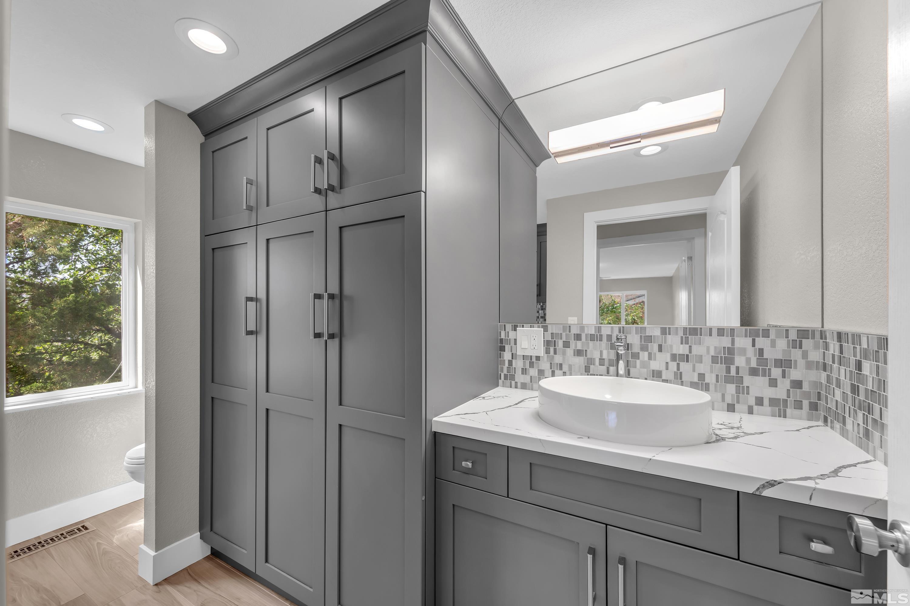 2370 Fireside Circle Reno, NV 89509 - Photo 19 of 29 a bathroom with a sink double vanity and a mirror