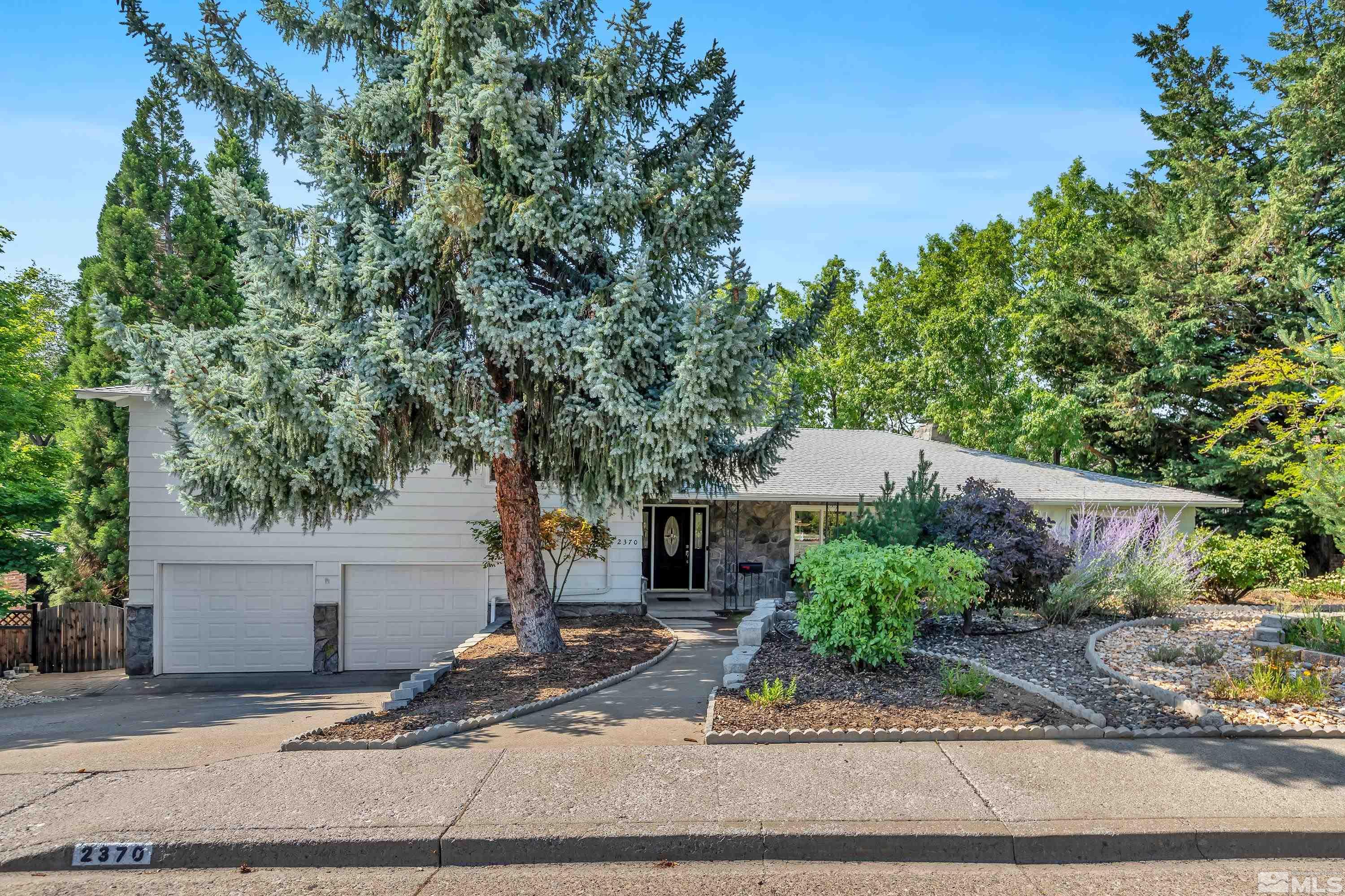 2370 Fireside Circle Reno, NV 89509 - Photo 23 of 29 a front view of a house with garden