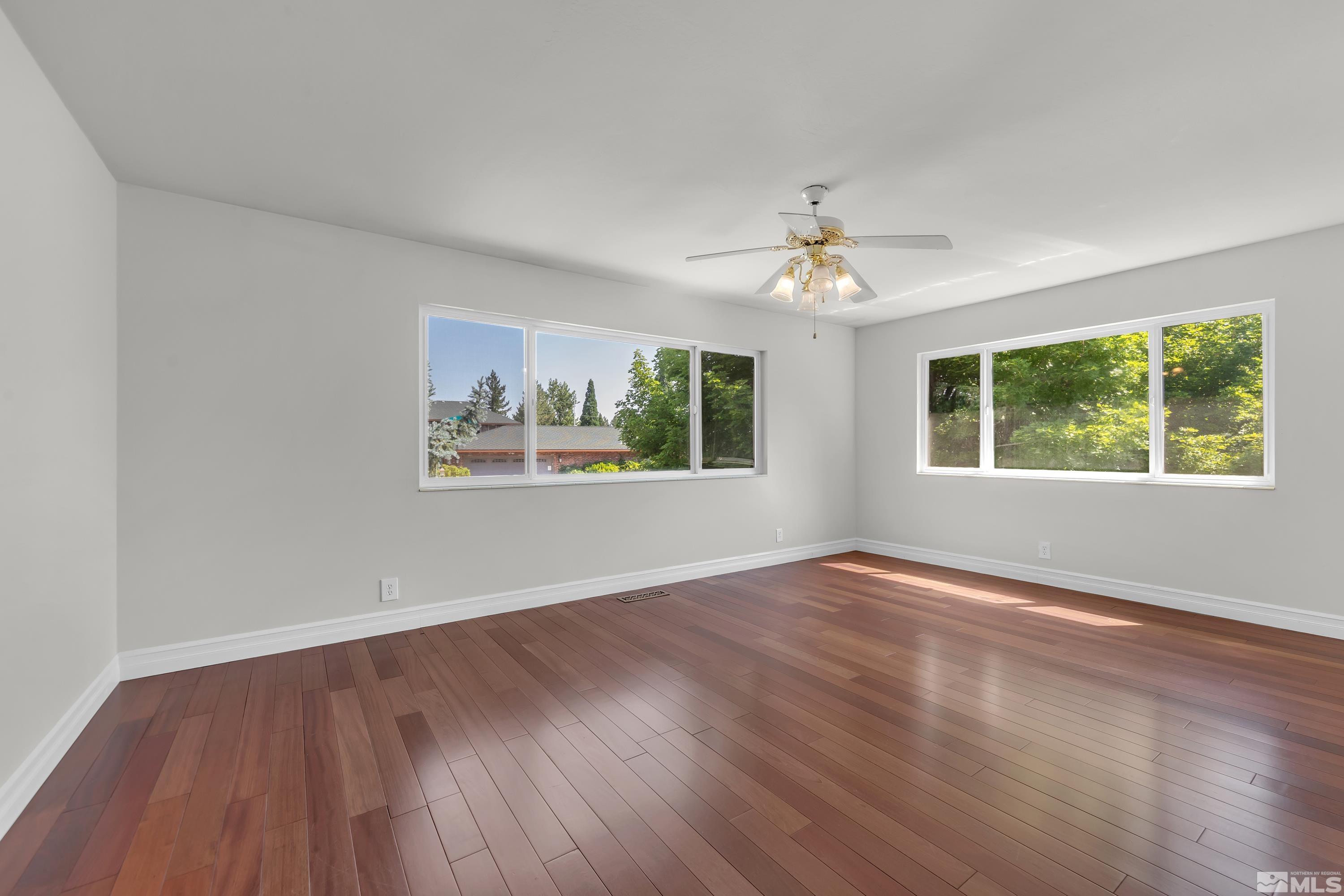 2370 Fireside Circle Reno, NV 89509 - Photo 28 of 29 a view of an empty room with window and wooden floor