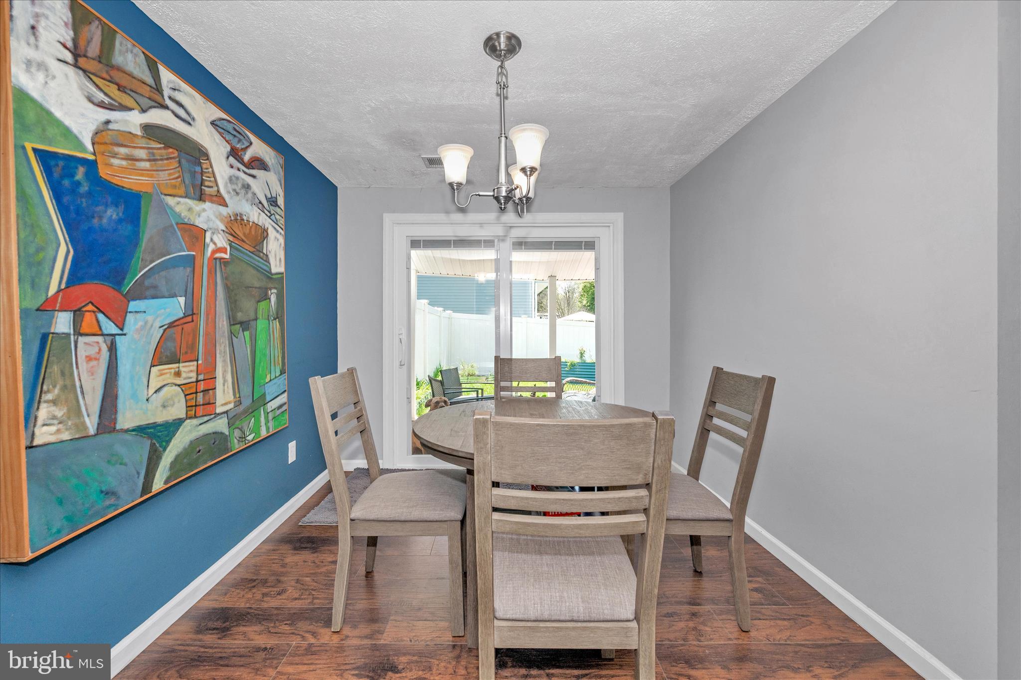 330 Heather Ridge Drive Frederick, MD 21702 - Photo 5 of 39 a view of a dining room with furniture a chandelier and wooden floor