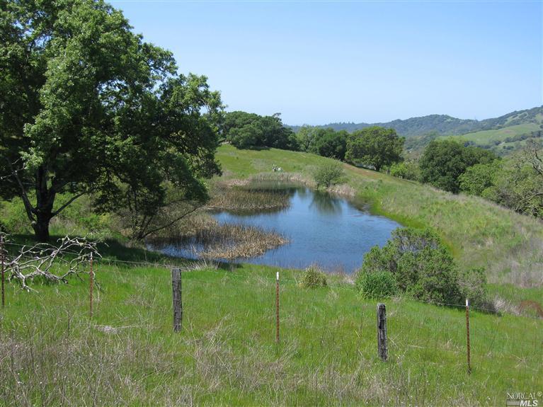 4000 Porter Creek Road Santa Rosa, CA 95404 - Photo 1 of 1 a view of a lake with green field