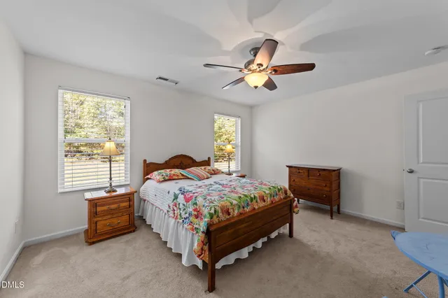 a bedroom with a bed and a table in it